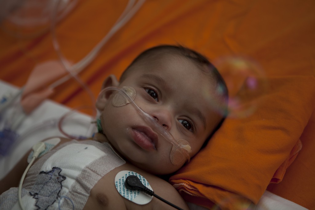 Baby looking at bubbles